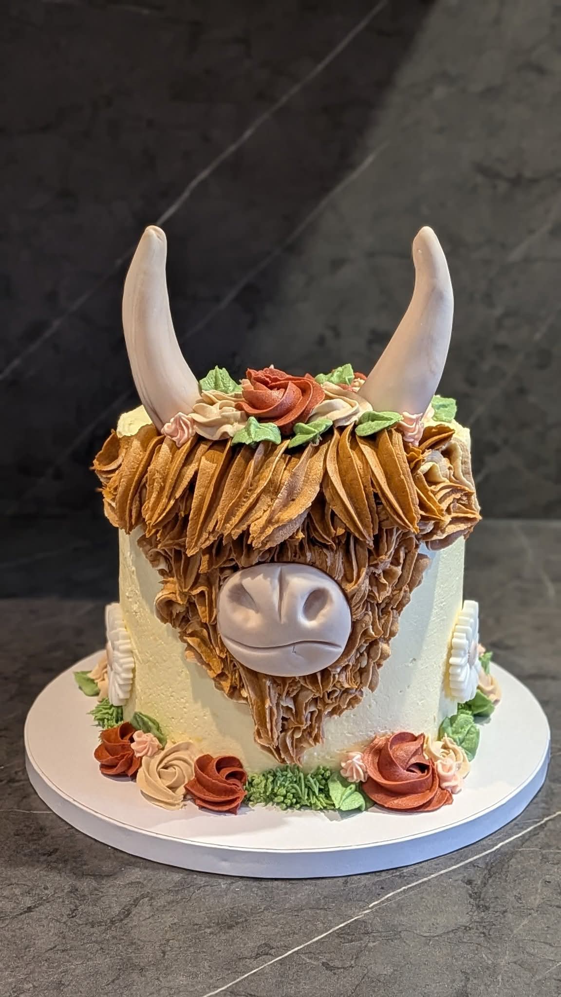 Highland cow floral birthday cake